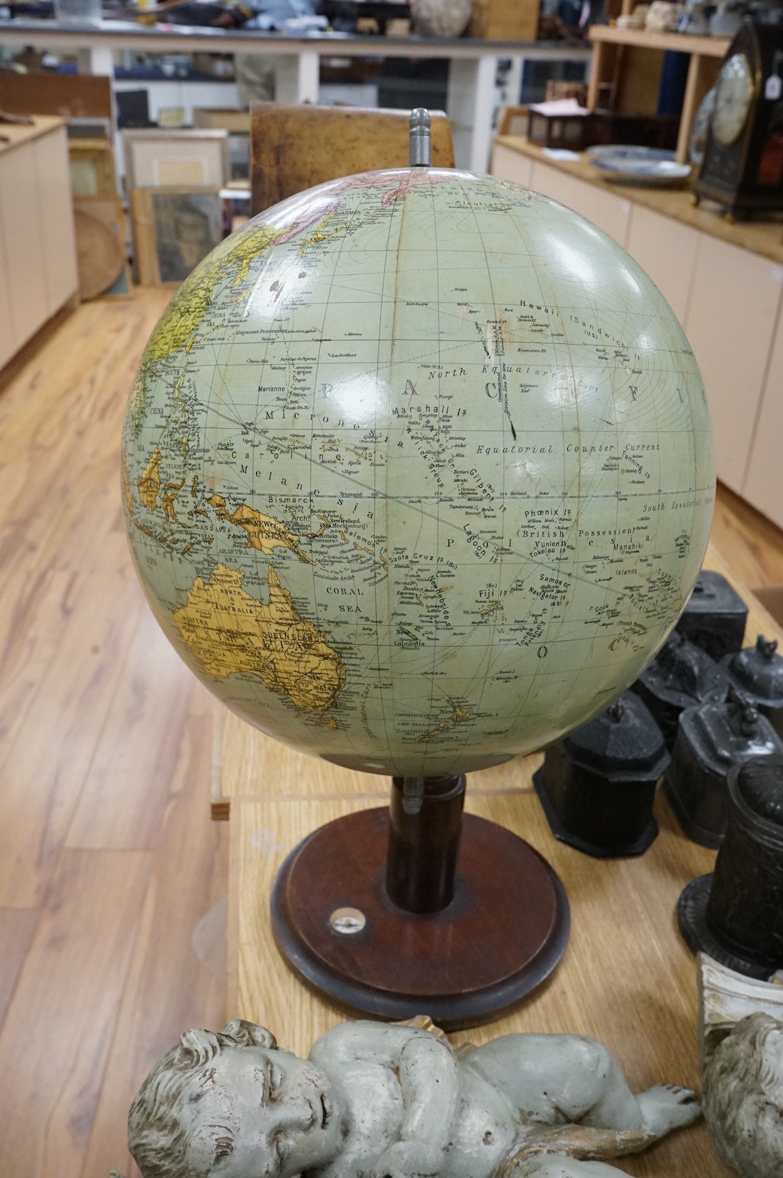 A vintage revolving globe with inset compass to the base, 55cm high